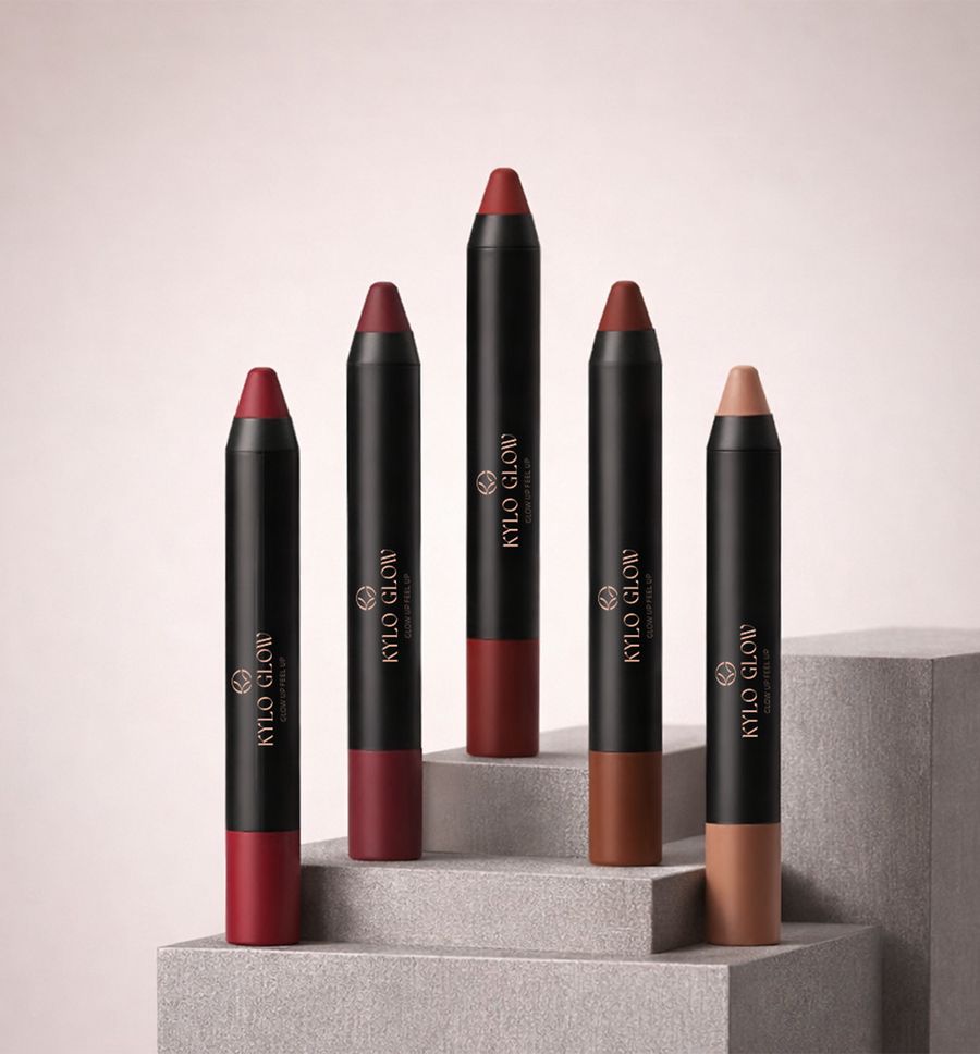Five KYLO GLOW crayon matte lipstick pencils arranged on a pale plinth